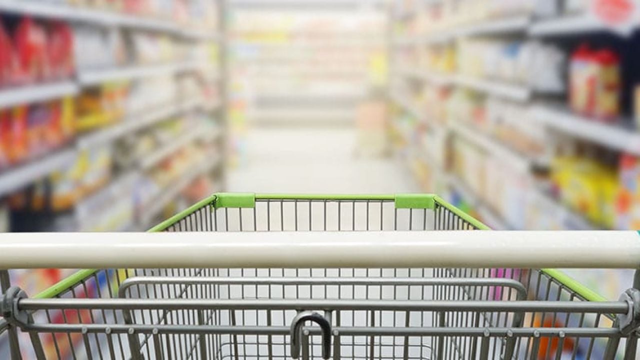 Viewpoint from a shopping cart down a grocery store aisle